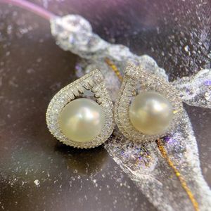 Boucles d'oreilles clous en perles d'eau douce blanches de 11-12 mm, rondes, en argent S925, forte brillance, légers défauts, tendance, vente en gros - Product Image 2