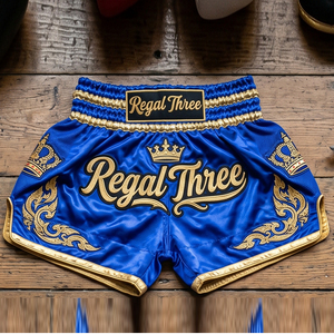 Pantalones Cortos de Muay Thai Regal Three Boxing, Azules con Bordado Dorado, Corte Regular para Hombre, 100% Poliéster, Pantalones Cortos de Artes Marciales - Product Image 1