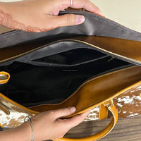 Sac polochon de voyage en cuir de vachette outillé à la main de luxe de marque avec sac cosmétique à bandoulière occidental assorti ensemble de deux pièces pour femmes