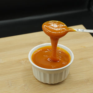 Purée d'orange 100% naturelle la plus vendue en sachet aseptique avec 65 Brix, stockage congelé, prix bas par Hunza Citrus and Pulp - Product Image 1