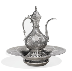 Exquisite <b>silver</b> surahi and basin set features highly dense scale-like textures and central leaf emblems. Available whole - Product Image 1