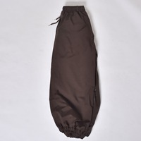 Pantalon de neige haute performance marron, imperméable et coupe-vent, avec isolation polaire et taille élastiquée pour adultes