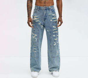 Jeans de hombre azul claro de pierna ancha con efecto desgastado, rotos y con parches deshilachados, corte relajado, estilo casual y moderno de mezclilla para streetwear. - Product Image 1