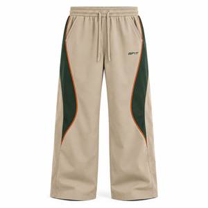 Pantalon de survêtement large pour homme, taille élastique avec cordon de serrage, blocs de couleur et bande latérale, décontracté, respirant, en polyester, pour l'automne - Product Image 1