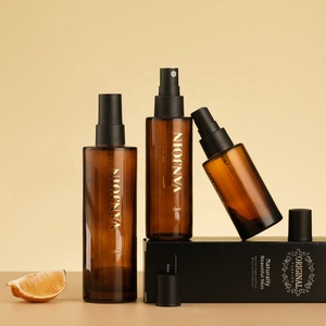 Bottiglia in Vetro Ambrato Cilindrica Portatile da 40ml 60ml 100ml con Pompa Spray Nera Opaca e Coperchio per Profumi e Fragranze per la Casa - Product Image 1