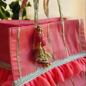 Radiant Peach Silk Festive Tote Handcrafted Ethnic <b>Handbag</b> with Organza Ruffles Golden Gota Patti Embellishments - Product Image 1