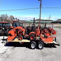 Tractor Kubota BX23S en buen estado con cargador frontal y retroexcavadora, implementos de cortacésped disponibles