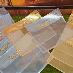 Elegante juego de sobres de organza transparente hechos a mano con adornos de perlas y cristales, perfecto para shagun de boda o lifafa. - Product Image 1