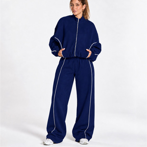 Conjunto Deportivo de Dos Piezas para Mujer con Cremallera Completa y Líneas en Contraste: Chaqueta Relajada y Pantalones de Pierna Ancha a Juego - Product Image 1