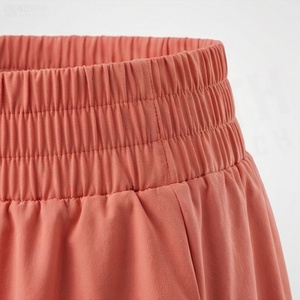 Jupe courte élastique à taille élastique pour femmes, style décontracté, couleur unie, tissu tissé 100% polyester, à porter en toutes saisons - Product Image 4