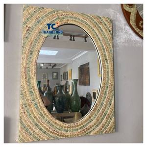 Espejo artístico de ratán del fabricante para importadores mayoristas, con la elegancia del espejo de luna de ratán y la resistencia de exportación de fábrica. - Product Image 1