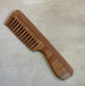 Sturdy <b>wide</b>-tooth wooden <b>comb</b> built with a solid grip handle for detangling, available at wholesale prices. - Product Image 1