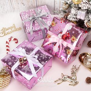 3 Rollos de Papel de Regalo Navideño Rosa de 17 Pulgadas x 10 Pies, Papel Metálico Brillante con Diseño de Santa Claus y Copos de Nieve, Mini Rollo de Papel para Envolver Regalos - Product Image 1