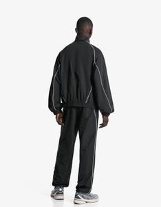 Ensemble de survêtement unisexe coupe-vent réfléchissant avec passepoil, veste et pantalon légers en polyester à fermeture éclair, vente en gros OEM - Product Image 5