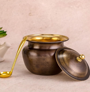 Elegant dark brass ghee <b>pot</b> with embossed details, separate <b>lid</b>, and a long golden spoon!!! available at wholesale price - Product Image 1