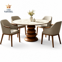Ensemble table à manger sur piétement et chaises rembourrées Vantel pour projet d'aménagement intérieur de villa de luxe, fournisseur OEM