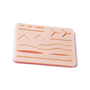 Coussin d'entraînement à la suture en silicone réutilisable avec 14 plaies réalistes, équipement de formation médicale et chirurgicale, fournisseur en gros - Product Image 1