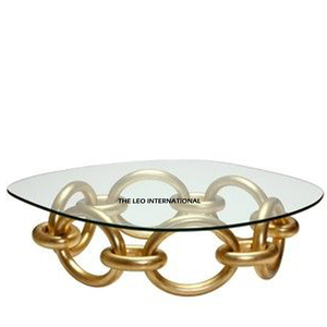Mesa de Centro de Vidrio Transparente con Forma Geométrica y Base de Aluminio Pulido Brillante, Procedente de la India - Product Image 1
