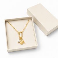 Collier mousqueton doré avec fermoir pavé de zircons et pendentif étoile polaire pour marques de bijoux de boutique en gros