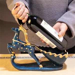 Support à bouteille de vin en acier inoxydable World Trend, élégant et luxueux, pour présentation sur table ou bar, Zahid Exports - Product Image 1