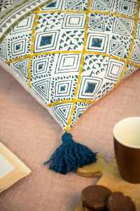 Salon confortable avec coussin décoratif bohème, livre ouvert, tasse à café et plante d'intérieur 16X24 - Product Image 3