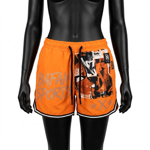 Shorts de baño premium de poliéster de secado rápido para mujer, color naranja y negro, con panel lateral gráfico, pedrería y logo personalizado. - Product Image 1