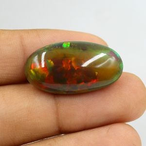 โอปอลเอธิโอเปียสีดำธรรมชาติ 22.00 กะรัต แบบคาโบชอง หลายสี ไฟหลากสี ผิวเรียบ ไม่มีตัวเรือน ใช้เป็นพลอยประจำเดือนตุลาคม ขนาด: 29X16X9 มม. - Product Image 2