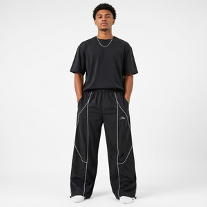 Pantalon de survêtement ample en polyester imperméable et coupe-vent pour homme, avec logo brodé personnalisé et passepoil tendance de haute qualité - Product Image 1