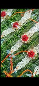 Elegant White Pearl Floral Rakhi Set for Children Handcrafted with a Vibrant <b>Red</b> <b>Rose</b> Centerpiece - Product Image 2
