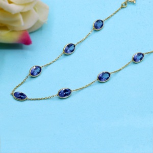Bracelet en or jaune massif 18 carats avec tanzanite ovale naturelle sertie clos, collection Memoria Jewels, vente en gros - Product Image 4
