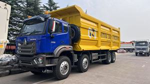 Camión Volquete SINOTRUK HOWO NX 8x4 para Minería y Construcción, 400HP, Camión Volquete de Servicio Pesado, Caja de Carga Tipo U de 6.8m - Product Image 1