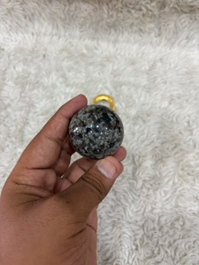 Yooperlite <b>sphere</b> with smoky gray stone body vibrant orange fluorescent glow polished curvature and distinctive mineral display - Product Image 3