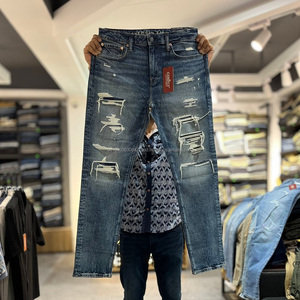 Vêtements en gros en stock, jeans pour hommes avec décoration boutonnée, patchwork, coupe slim, jeans en denim déchirés pour hommes, pantalon en stock - Product Image 2