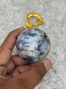 Banded aragonite <b>sphere</b> with layered mineral patterns earthy tones polished round form natural texture and distinctive - Product Image 1