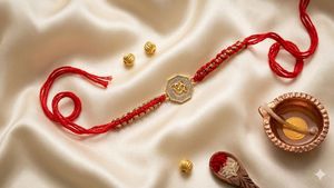 Adjustable red woven rakhi <b>bracelet</b> featuring a gold-plated CZ “Om” charm, perfect as a stylish rakhi or a thoughtful anniversar - Product Image 1