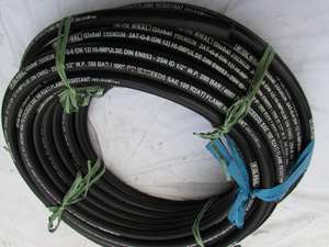 <b>Coiled</b> industrial power <b>cable</b> on construction site with concrete slab heavy machinery building materials development background - Product Image 2