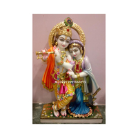 Patung Dewa Radha Krishna dari Marmer Putih Alami dengan Permukaan Halus dan Mengkilap yang Dipoles, Digunakan untuk Dekorasi Festival dan Hadiah.