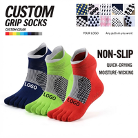 Chaussettes de football personnalisées à forte valeur ajoutée Chaussettes à prise en main d'usine Chaussettes antidérapantes