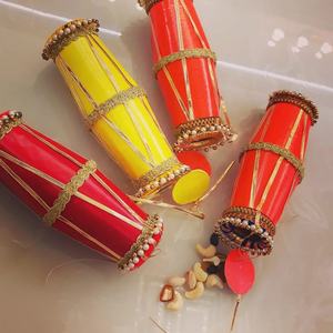 Conos de frutos secos festivos Shagun hechos a mano en rojo y amarillo, bellamente diseñados para bodas, rituales de pooja y inauguración de casas. - Product Image 1