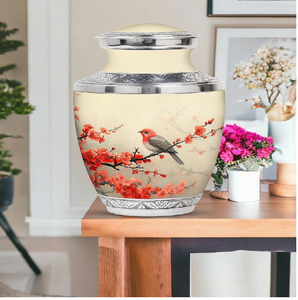 Urna azul vibrante con un detalle de un petirrojo en una rama, que captura la tranquilidad y la belleza de la naturaleza. Disponible a precios de mayorista. - Product Image 3