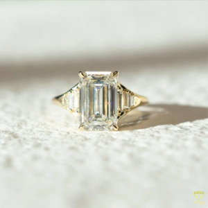 Elegant <b>Emerald</b> Cut Lab Grown Diamond <b>Ring</b> With Tapered Side Stones And Luxurious Gold Band Design - Product Image 2