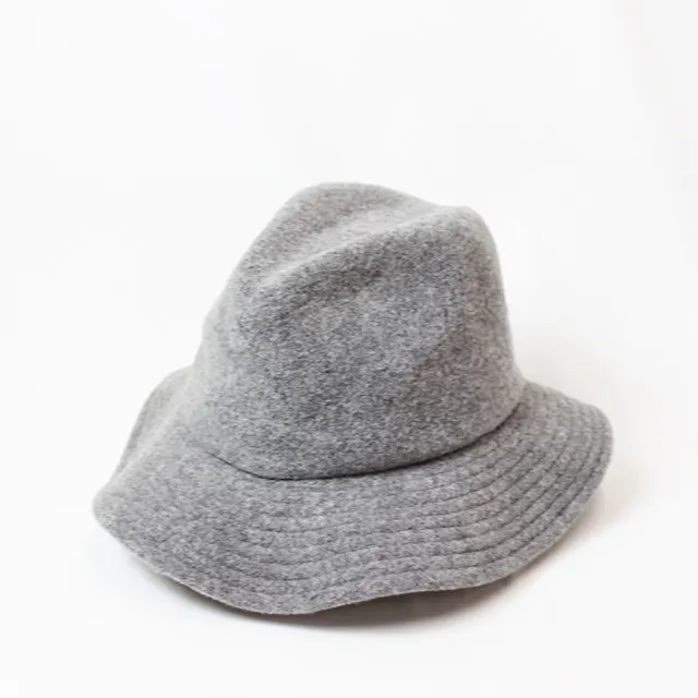 A wide brimmed hat of straw like material