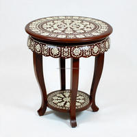 Table élégante artisanale pour une décoration intemporelle du salon et de la chambre à coucher, design complexe en incrustation d'os, ronde, en bois, moderne