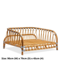 Vente en gros de lit de jour pour animaux de compagnie en rotin naturel cadre incurvé coussin souple lit durable pour chien et chat pour une utilisation en intérieur motif animal de style classique