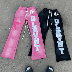 Pantalon de survêtement évasé vintage pour homme en coton délavé, avec broderie appliquée et ourlet personnalisé - Product Image 1