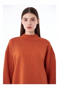Stylish woman in bright bubblegum <b>pink</b> mockneck <b>sweatshirt</b> featuring elegant lace details on neckline and hem with oversized rel - Product Image 2