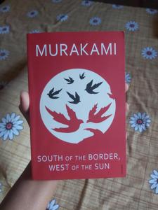 ปกหนังสือ "ทางใต้ของชายแดน ทางตะวันตกของดวงอาทิตย์" โดยฮารูกิ มุราคามิ หนังสือปกอ่อนภาษาอังกฤษ นวนิยายวรรณกรรม - Product Image 1