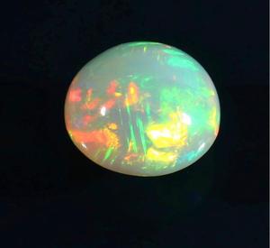 Opale d'Éthiopie naturelle multicolore et chatoyante, cabochon rond. - Product Image 6