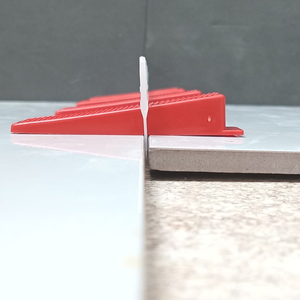 Red <b>tile</b> spacers clips White clips edge protection Self-adhesive <b>leveling</b> system Viet Nam <b>tile</b> supplier - Product Image 4