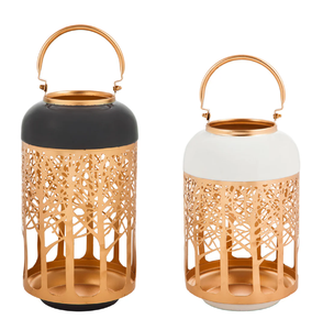Charming forest themed metal <b>lanterns</b> in two-tone <b>black</b> and white finishes with gold bases, available at wholesale prices. - Product Image 1